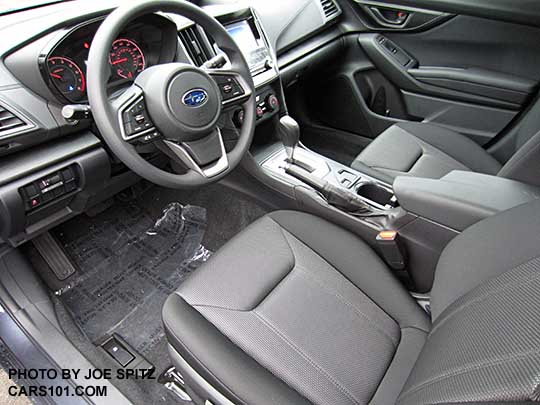 2017 Subaru Impreza 2.0i interior, CVT transmission with silver surround, no heated seat buttons, 6.5" audio screen, black cloth shown