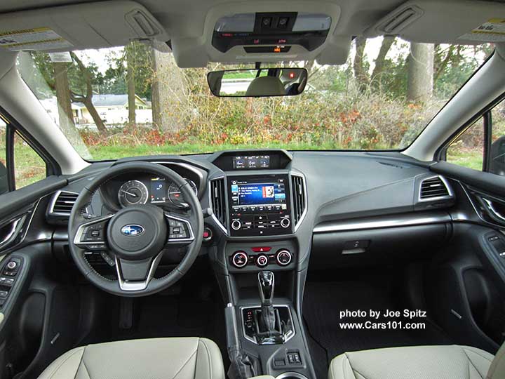 2017 Subaru Impreza Limited interior,  8" audio screen, leather wrapped, silver stitched steering wheel, gloss black shift knob and surround, matte silver dash trim, automatic climate control silver trimmed knobs, large color upper trip computer. Optional Eyesight cameras.  Ivory leather shown