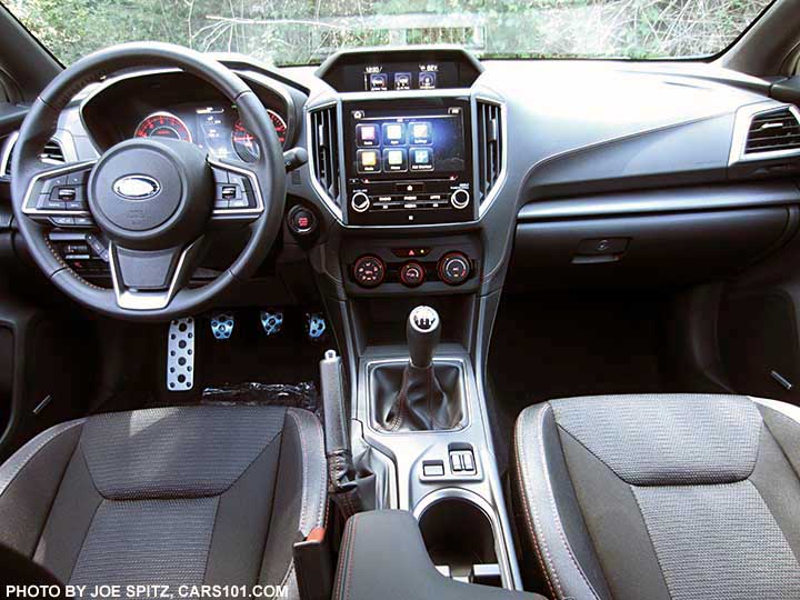 2017 Subaru Impreza Sport manual transmission, black sport cloth interior. Leather wrapped steering wheel, metal gas, brake, clutch, footrest pedal covers, pushbutton start/stop, 8" audio with Android Auto and Apple Carplay, large upper console trip computer, manual heat/ac control knobs, heated seat buttons,