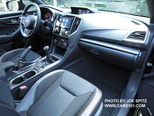 2017 Subaru Impreza Sport manual transmission interior, black sport cloth with red stitching, patterned passenger side dash trim
