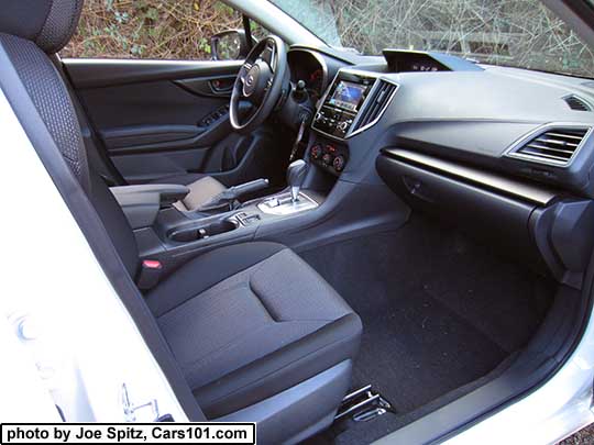 2017 Subaru Impreza Premium passenger side dash, silver shift surround, and passenger seat with black cloth interior
