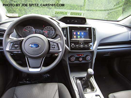 2017 Subaru Impreza 2.0i base model interior, dash and steering wheel, manual transmission shown