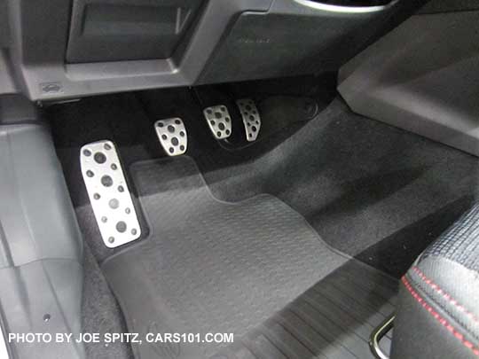 optional metal pedal covers and rubber all weather floor mat. The metal pedals are standard on Sport models. Showing manual transmission model with clutch pedal.