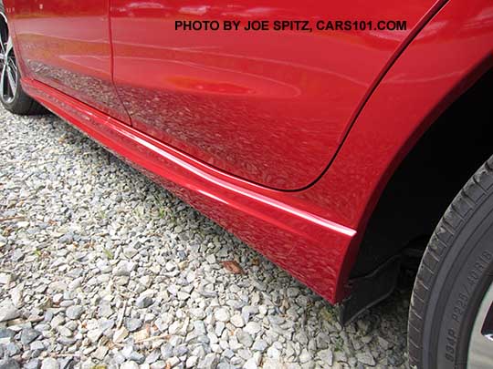 closeup up of the 2017 Subaru Impreza Sport rocker panel trim, body colored. Rear looking front. Lithium red shown.