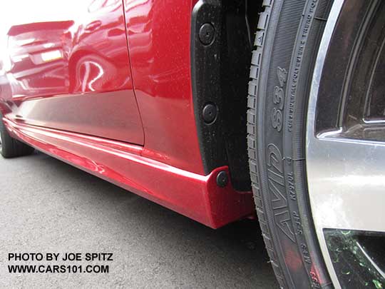 2017 Subaru Impreza Sport lower rocker panel with extra trim piece only available on the Sport 4 and 5 door. Lithium red car shown. Front looking toward rear.