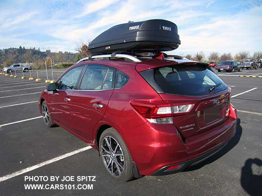 2017 Subaru Impreza Premium and Limited 5 door hatchback silver roof rails with optional aero croissbars and Thule cargo box. Limited car shown.
