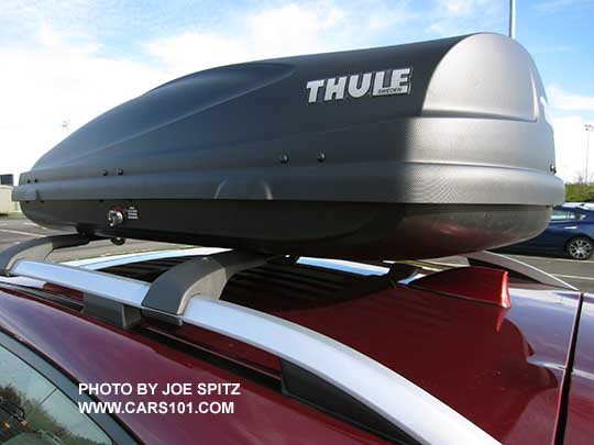 closeup of the 2017 Subaru Impreza Premium and Limited silver roof rails with optional aero crossbars and Thule cargo box