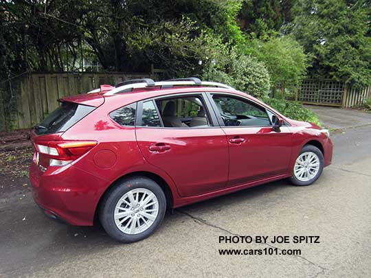 2017 Subaru Impreza Premium 5 door hatchback, body colored door handles and mirrors, 16" silver alloys, silver roof rack rails with optional aero cross bars. Venetian Red car shown