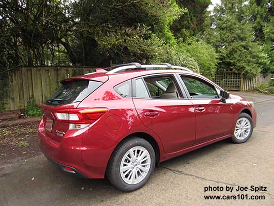 2017 Subaru Impreza Premium 5 door hatchback, body colored door handles and mirrors, 16" silver alloys, silver roof rack rails with optional aero cross bars. Venetian Red car shown