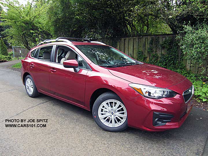 2017 Subaru Impreza Premium 5 door hatchback, body colored door handles and mirrors, 16" silver alloys, silver roof rack rails with optional aero cross bars. Venetian Red car shown