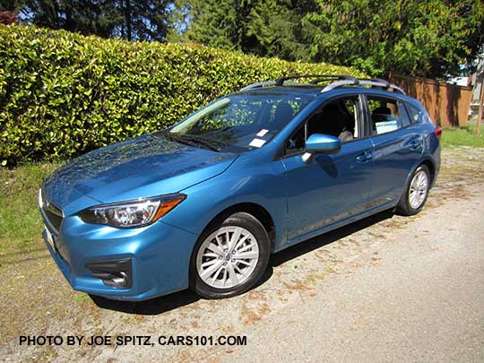 2017 Subaru Impreza 5 door hatchback. Island blue pearl color. with 16" silver alloys, silver roof rack rails, body color door handles and mirrors