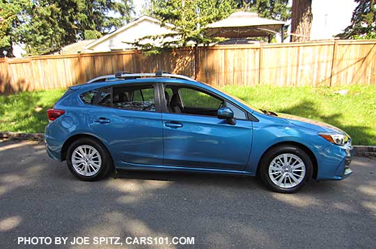 2017 Subaru Impreza 5 door hatchback. Island blue pearl color with the shade.  With 16" silver alloys, silver roof rack rails, body color door handles and mirrors. Optional roof rack aero crossbars.