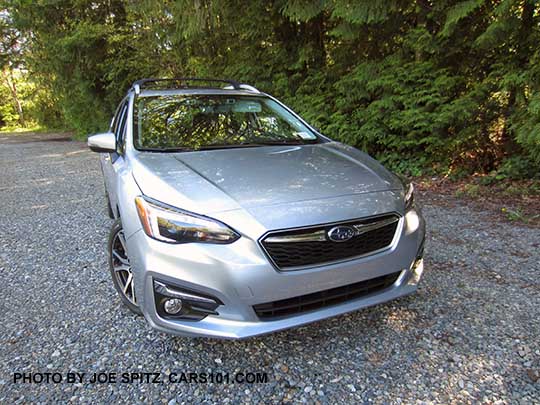 ice silver 2017 Subaru Impreza Limited 5 door hatchback front view. Silver fog light trim, silver roof rack rails, machined 17" alloys.