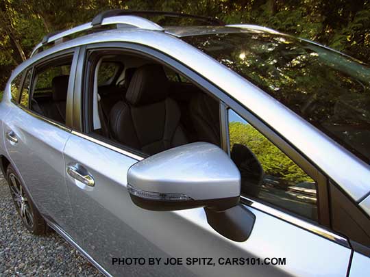 ice silver 2017 Subaru Impreza Limited 5 door hatchack has body colored outside mirrors with turn signals, silver lower window trim, silver roof rack rails