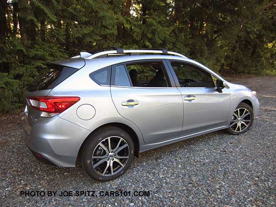 2017 ice silver color Subaru Impreza Limited 5 door hatchback has 17" machined alloys, silver roof rack rails, silver door handles.