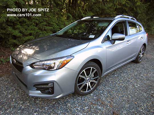 2017 Subaru Impreza Limited 5 door hatchback has 17" machined alloys, silver fog light trim, silver roof rack rails, silver door handles. Ice silver color shown.