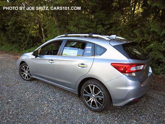 2017 Subaru Impreza Limited 5 door hatchback has 17" machined alloys, silver fog light trim, silver roof rack rails with optional crossbars, silver door handles. Ice silver color shown. Optional cross bars.