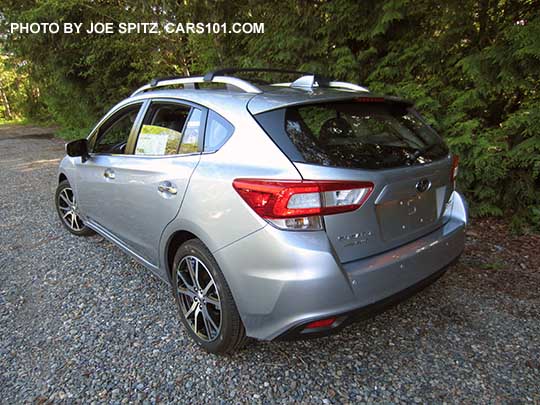 2017 Subaru Impreza Limited 5 door hatchback has 17" machined alloys, silver fog light trim, silver roof rack rails, silver door handles. Ice silver color shown.