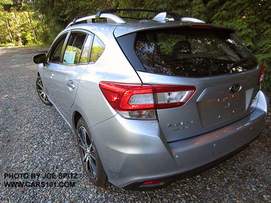 2017 Subaru Impreza Limited 5 door hatchback has 17" machined alloys, silver fog light trim, silver roof rack rails with optional cross bars. Ice silver color shown.