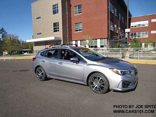 2017 Subaru Impreza Limited 5 door hatchback has 17" machined alloys, silver fog light trim, silver roof rack rails, silver door handles. Ice silver color shown.