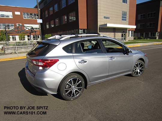 2017 Subaru Impreza Limited 5 door hatchback has 17" machined alloys, silver roof rails with optional cross bars, silver door handles. Ice silver color shown.