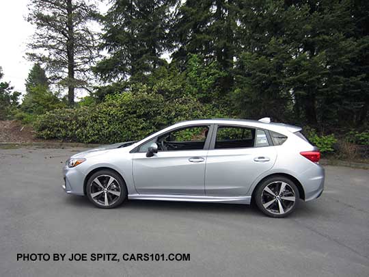 2017 ice silver Subaru Impreza Sport 5 door hatchback. 18" machined alloys, LED daytime running lights, silver door handles, body colored mirrors with turn signals. No roof rack rails.