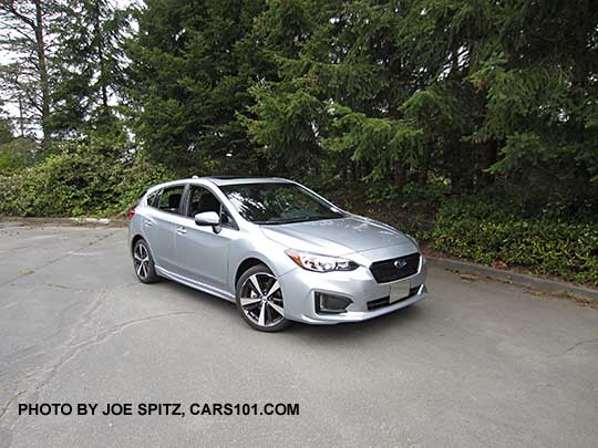 2017 ice silver Subaru Impreza Sport 5 door hatchback. 18" machined alloys, LED daytime running lights, silver door handles, body colored mirrors with turn signals. No roof rack rails