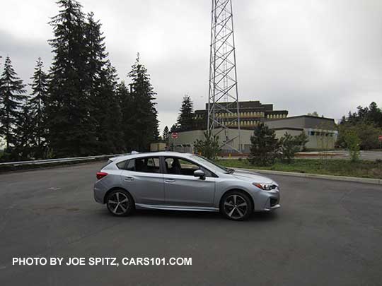 2017 ice silver Subaru Impreza Sport 5 door hatchback. 18" machined alloys, LED daytime running lights, silver door handles, body colored mirrors with turn signals. No roof rack rails