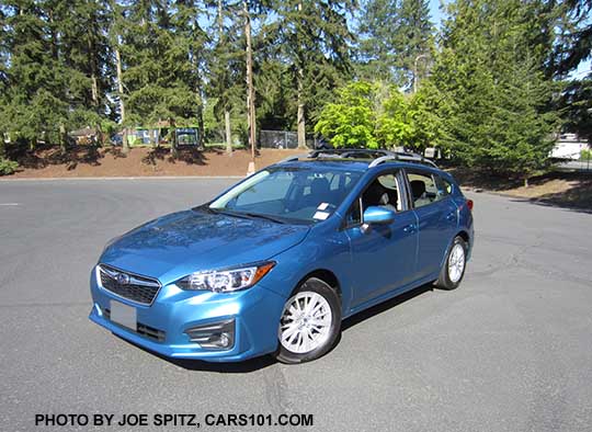 2017 Subaru Impreza Premium 5door hatchback, Island Blue color. 16" silver alloys, silver roof rack rails, body colored mirrors and door handles. With optional Eyesight by the rear view mirror, fog lights (incl with Eyesight), and roof rack aero crossbars.