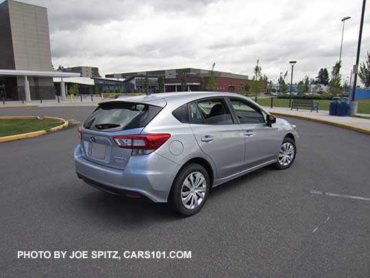 rear view 2017 Subaru Impreza 2.0i base model 5 door hatchback, ice silver, steel wheels with covers, no roof rails.