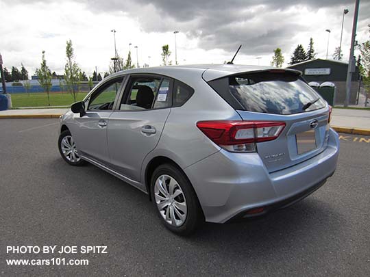 2017 Subaru Impreza 2.0i base model 5 door hatchback, ice silver, steel wheels with covers, no roof rails.