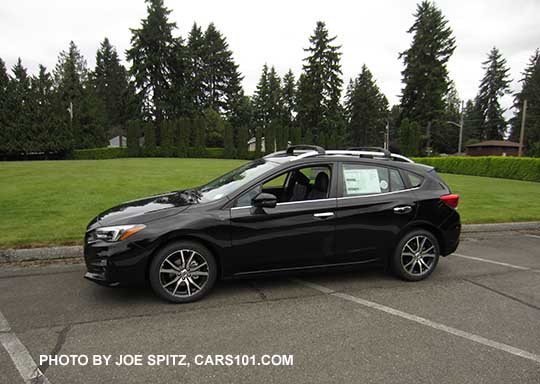 crystal black 2017 Subaru Impreza Limited 5 door hatchback, with silver roof rails, door handles, lower window trim, and fog light trim. 17" machined alloys.