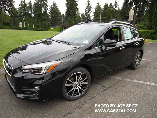 crystal black 2017 Subaru Impreza Limited 5 door hatchback, with silver roof rails, door handles, lower window trim, and fog light trim. 17" machined alloys.