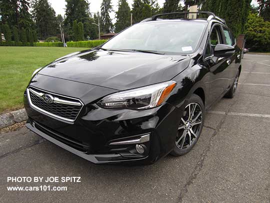 crystal black 2017 Subaru Impreza Limited 5 door hatchback, with silver roof rails, door handles, lower window trim, and fog light trim. 17" machined alloys.