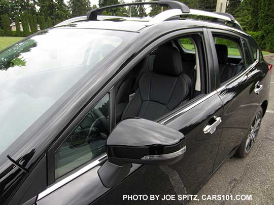 crystal black 2017 Subaru Impreza Limited 5 door hatchback body colored outside mirror with turn signal, and silver lower window trim.