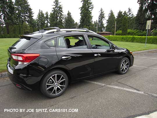 crystal black 2017 Subaru Impreza Limited 5 door hatchback, with silver roof rails, door handles and lower window trim. 17" machined alloys.