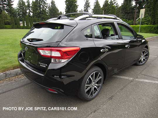 crystal black 2017 Subaru Impreza Limited 5 door hatchback, with silver roof rails, door handles and lower window trim. 17" machined alloys.