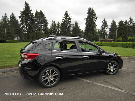 crystal black 2017 Subaru Impreza Limited 5 door hatchback, with silver roof rails, door handles and lower window trim. 17" machined alloys.
