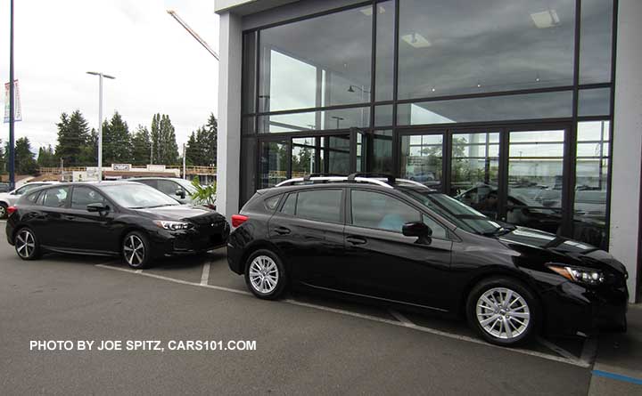 2017 Subaru Impreza crystal black 5 door Sport and Premium model next to each other