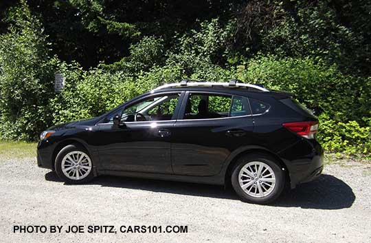 2017 Subaru Impreza crystal black 5 door Premium hatchback with silver roof rails and silver alloy wheels