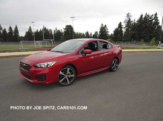 2017 Subaru Impreza Sport 4 door sedan, 18" alloys, black rear spoiler. lithium red pearl shown.