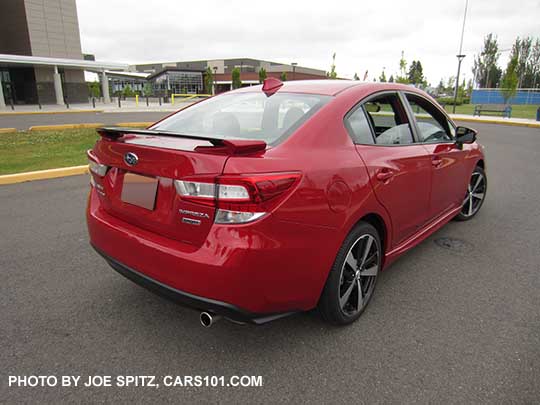 2017 Subaru Impreza Sport 4 door sedan, 18" alloys, black rear spoiler with body colored supports,  lithium red pearl shown.