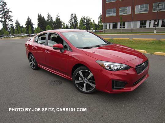 2017 Subaru Impreza Sport 4 door sedan, turn signal outside mirrors,  18" machined alloys, black rear spoiler. lithium red pearl shown.