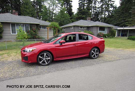 2017 Subaru Impreza Sport 4 door sedan, 18" alloys, black rear spoiler. lithium red pearl shown.