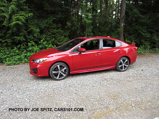 2017 Subaru Impreza Sport 4 door sedan, 18" machined alloys, black rear spoiler with body colored ends. lithium red pearl shown