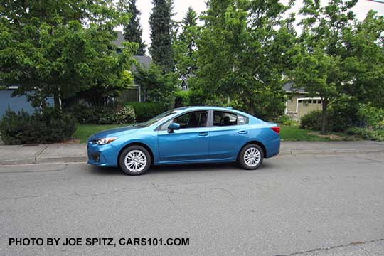 2017 Subaru Impreza Premium 4 door sedan. Silver 16" alloys, body colored door handles and outside mirrors.  Island blue color shown.