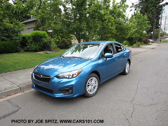 2017 Subaru Impreza Premium 4 door sedan. Silver 16" alloys, body colored outside mirrors.  Island blue color shown.