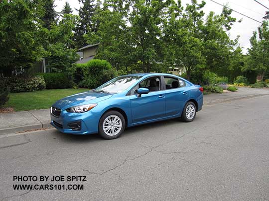 2017 Subaru Impreza Premium 4 door sedan. Silver 16" alloys, body colored outside mirrors.  Island blue color shown.