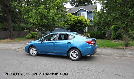 2017 Subaru Impreza Premium 4 door sedan. Silver 16" alloys, no rear trunk spoiler.  Island blue color shown.