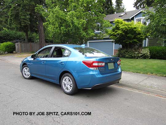 2017 Subaru Impreza Premium 4 door sedan. Silver 16" alloys, body colored door handles, no rear trunk spoiler.  Island blue color shown.